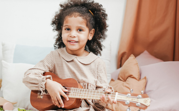 girl playing ukulele