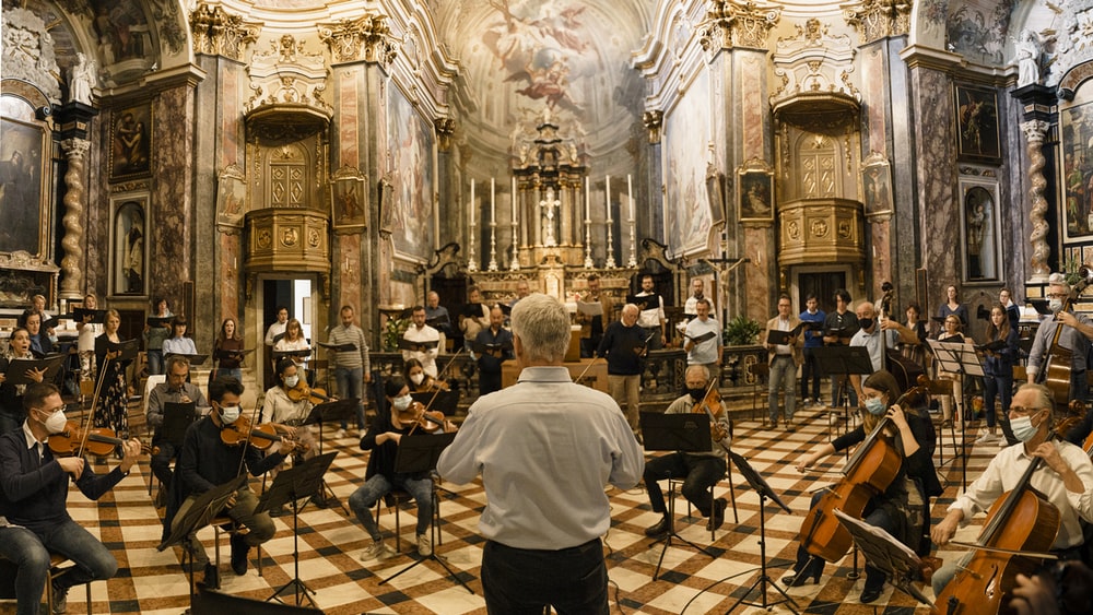 a violin lesson in an auditorium 