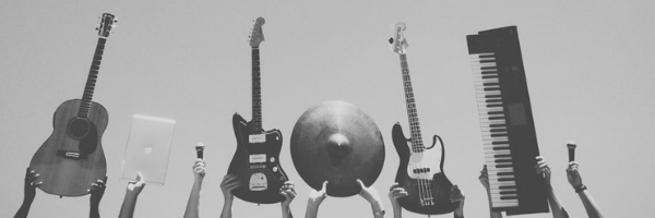 people holding several musical instruments for beginners.