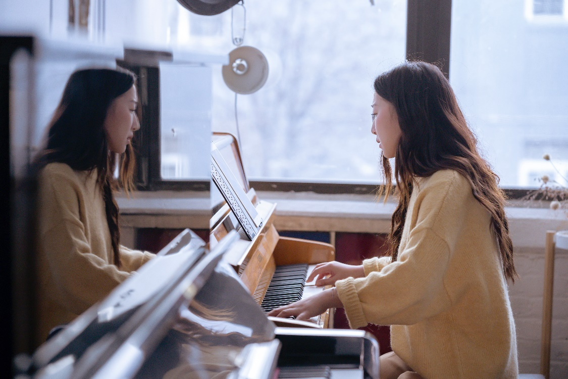 A woman playing the piano