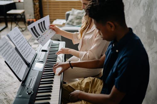 tallying notes at a piano