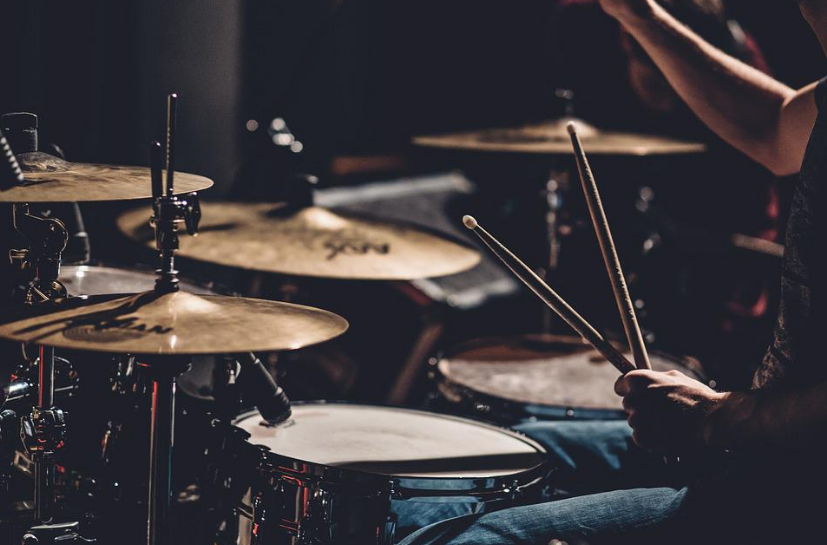 a man playing the drums at a concert