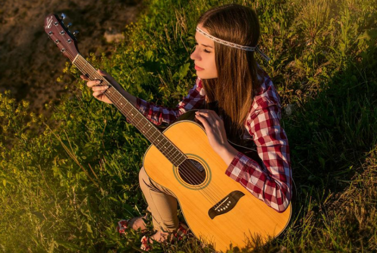 : girl sitting in an open space