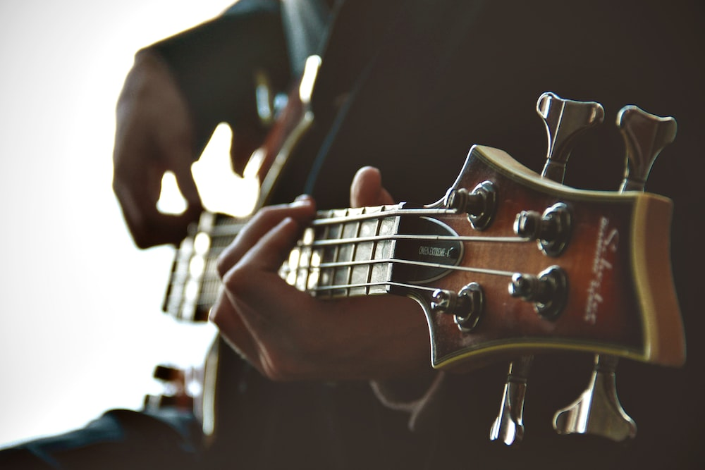 Close-up shot of a person playing a guitar