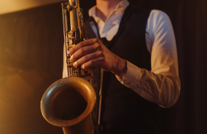 Person playing saxophone. 